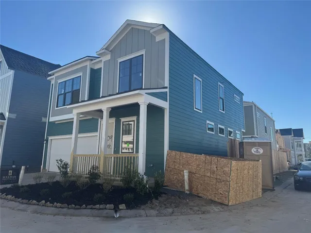a front view of a house with garage