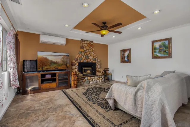 a living room with furniture and a rug