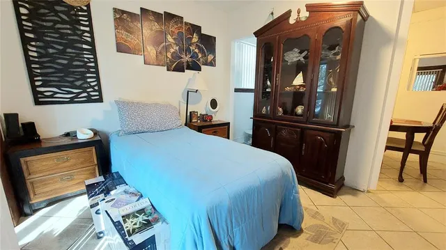 a bedroom with a bed and cabinets