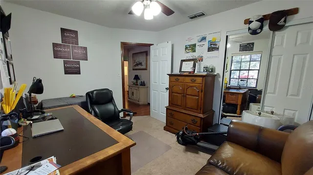 a bedroom with furniture and a window
