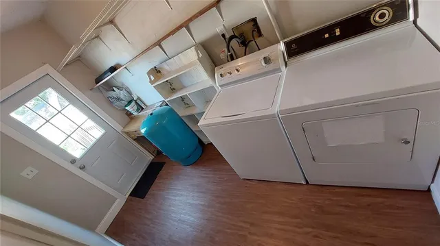 an entryway with wooden floor