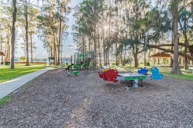 a view of a park with large trees