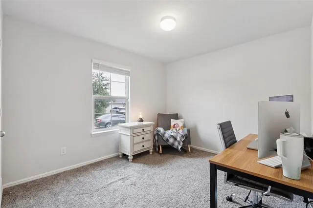 a bedroom with furniture and a window