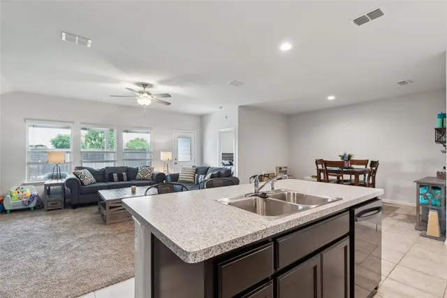 a kitchen with a counter top space and a sink