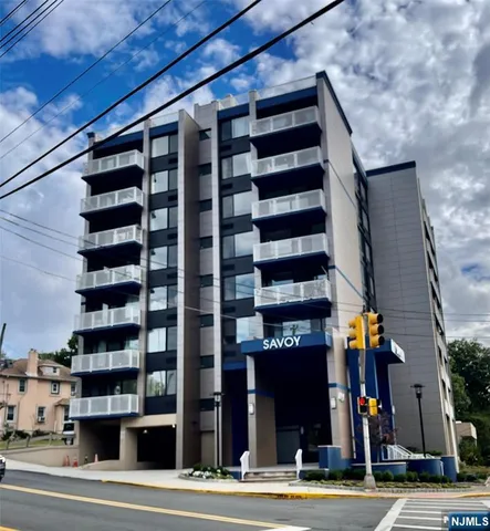 a view of street with tall buildings