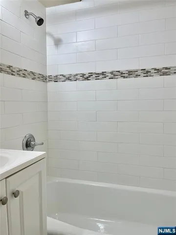 a bathroom with a shower and a bathtub