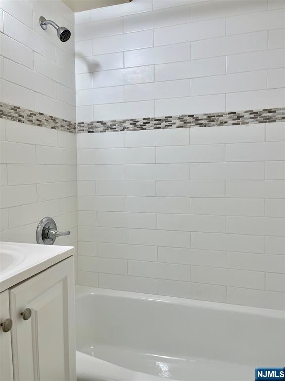 464 Gorge Road, Unit 5H Cliffside Park, NJ 07010 - Photo 5 of 7 a bathroom with a shower and a bathtub