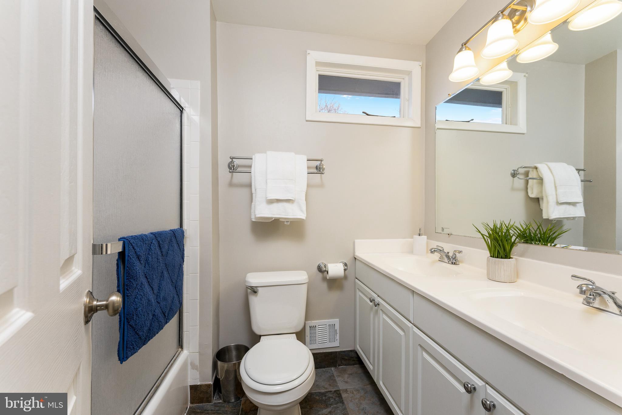 7013 Galgate Drive Springfield, VA 22152 - Photo 16 of 58 HALL BATHROOM W/DOUBLE SINKS & NATURAL LIGHT