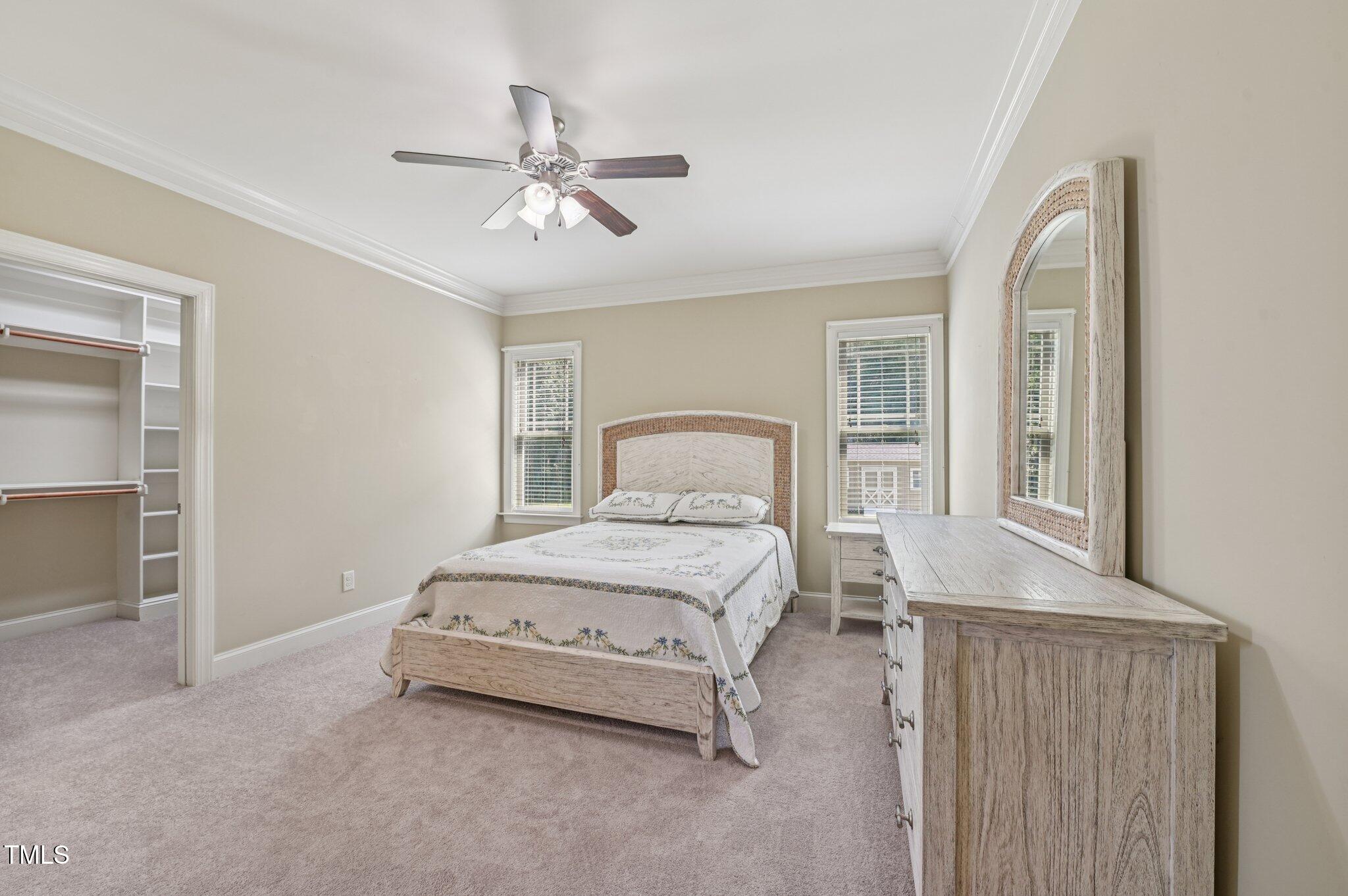 75 Crestline Drive Selma, NC 27576 - Photo 13 of 31 a bedroom with a bed and window