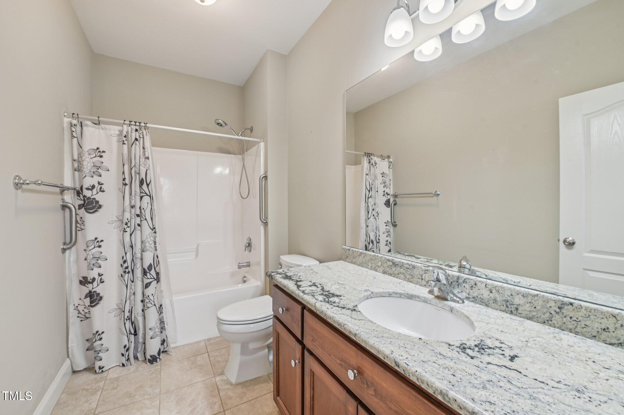 75 Crestline Drive Selma, NC 27576 - Photo 20 of 31 a bathroom with a granite countertop sink toilet and shower