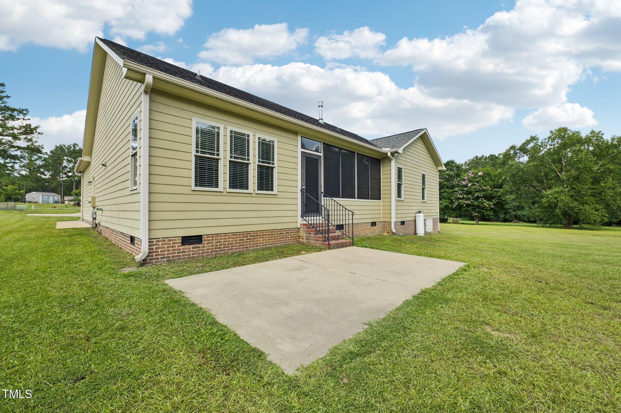 75 Crestline Drive Selma, NC 27576 - Photo 29 of 31 a front view of house with yard and green space