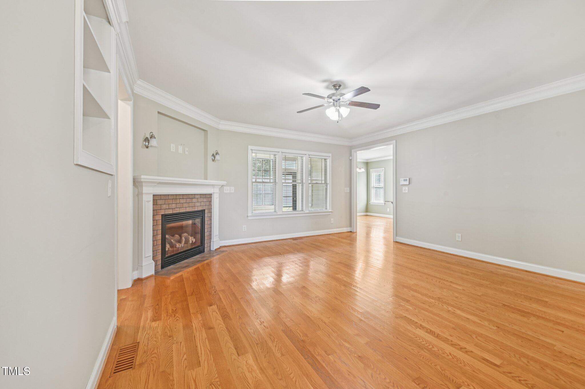 75 Crestline Drive Selma, NC 27576 - Photo 5 of 31 a view of empty room with wooden floor and fireplace