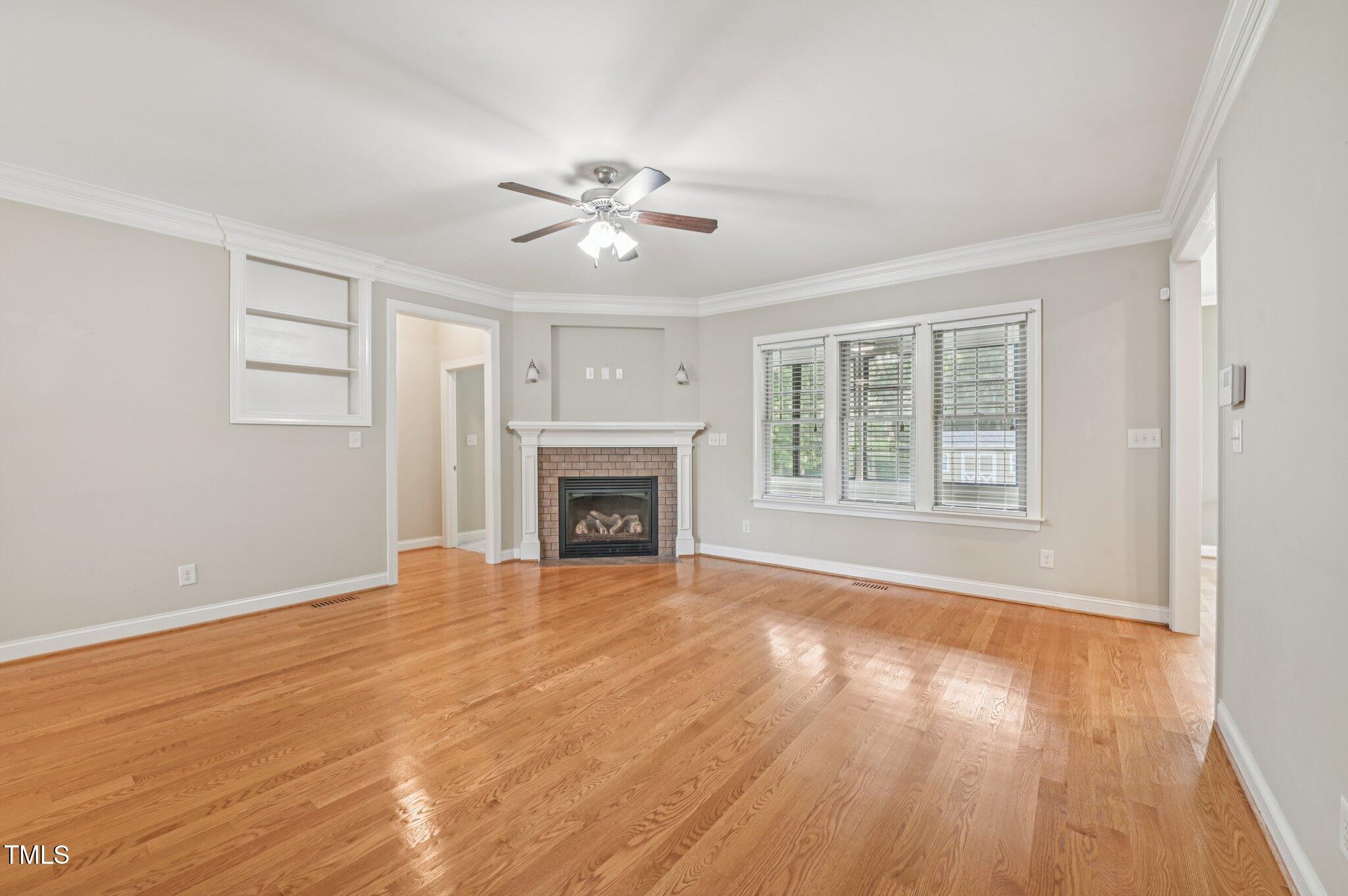 75 Crestline Drive Selma, NC 27576 - Photo 6 of 31 a view of empty room with wooden floor and fan