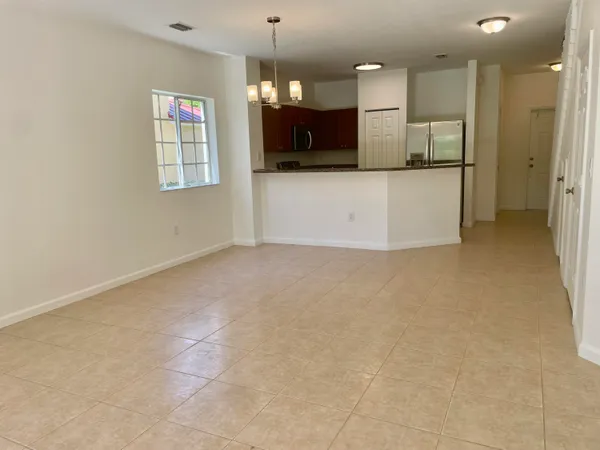 a view of a kitchen with a sink and a large mirror