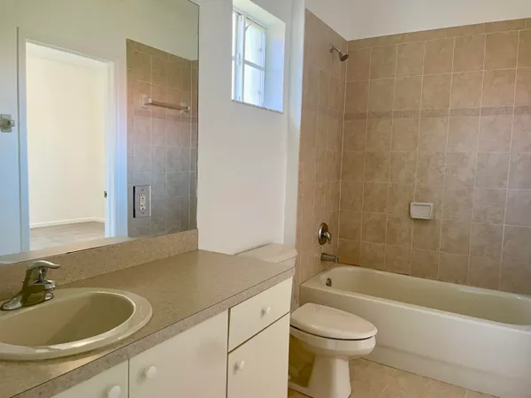 a bathroom with a sink a toilet and a bathtub
