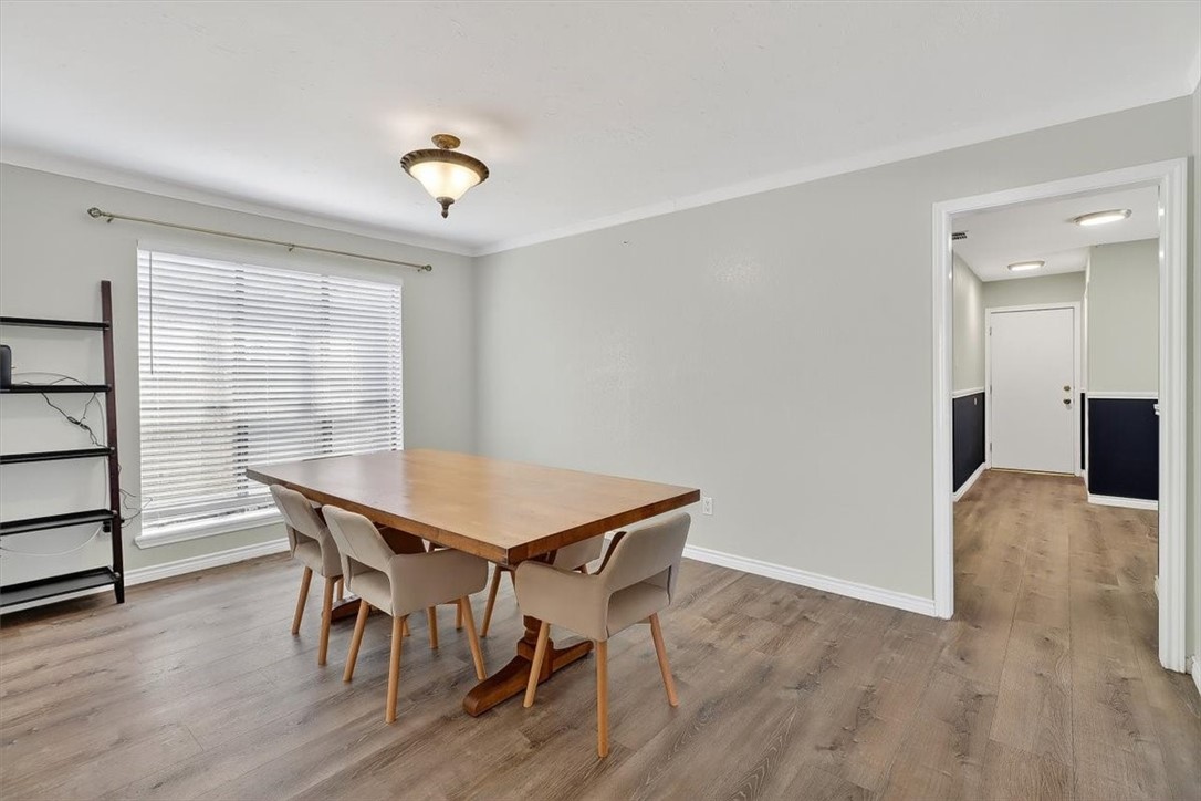 5410 Fox Run Drive Corpus Christi, TX 78413 - Photo 11 of 40 a view of a dining room with furniture and wooden floor