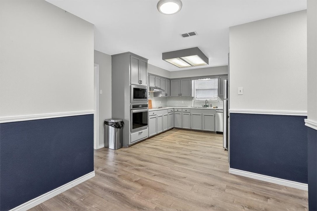 5410 Fox Run Drive Corpus Christi, TX 78413 - Photo 16 of 40 a kitchen with stainless steel appliances a refrigerator and a stove top oven