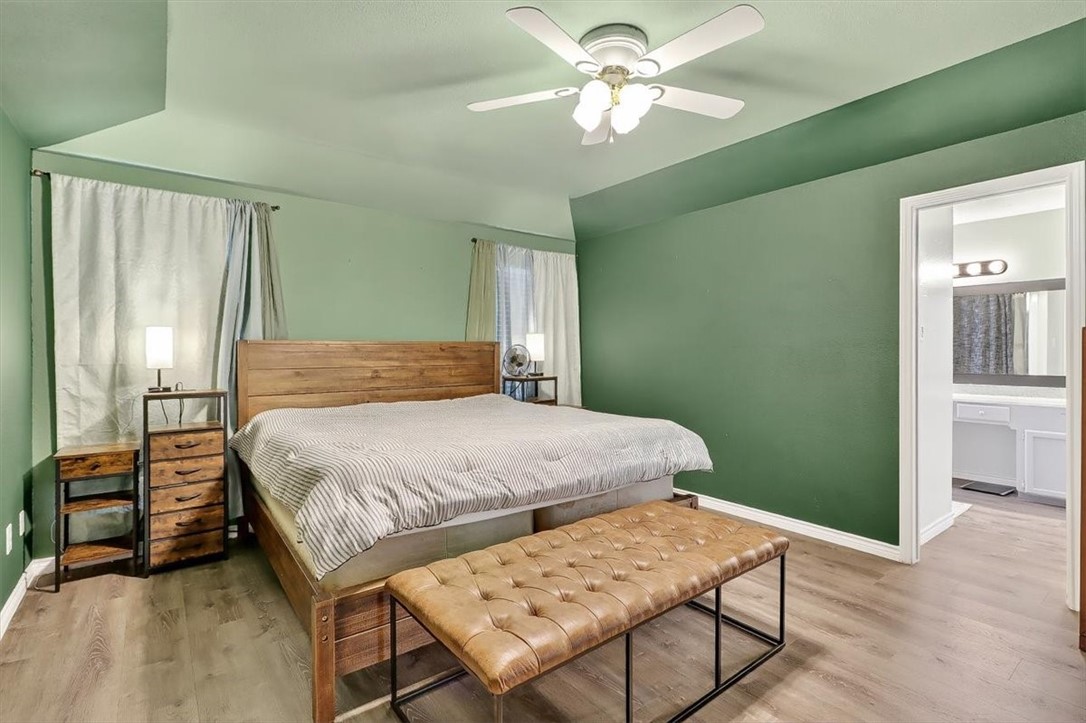 5410 Fox Run Drive Corpus Christi, TX 78413 - Photo 21 of 40 a bedroom with a bed chandelier and a window