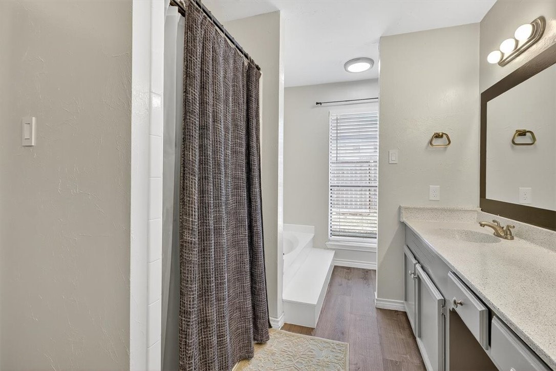 5410 Fox Run Drive Corpus Christi, TX 78413 - Photo 23 of 40 a bathroom with a sink a vanity and a mirror