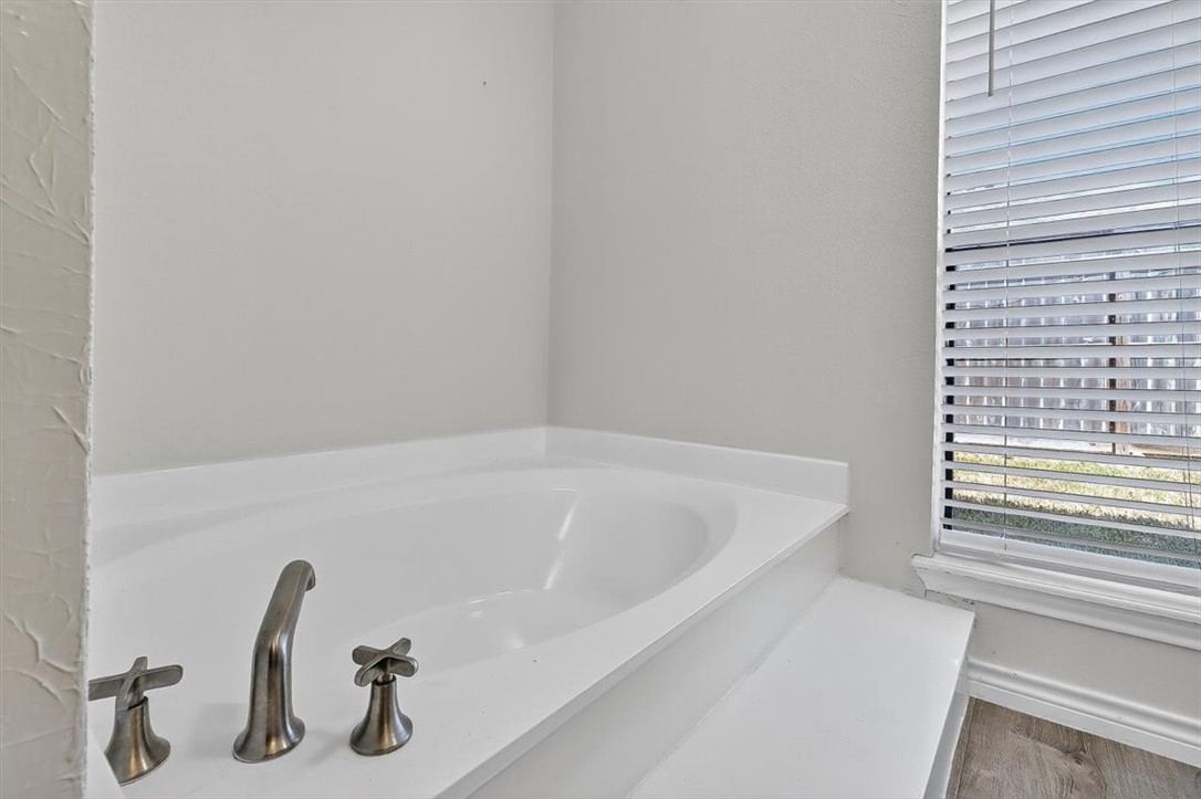 5410 Fox Run Drive Corpus Christi, TX 78413 - Photo 24 of 40 a bathroom with a tub and a window