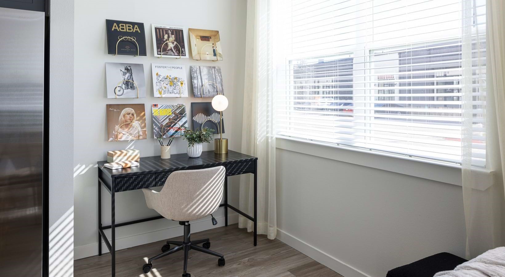 1505 Oliver Street, Unit 203 Houston, TX 77007 - Photo 5 of 19 a view of a workspace room with furniture and wooden floor