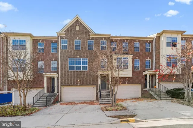 a front view of a building with garden