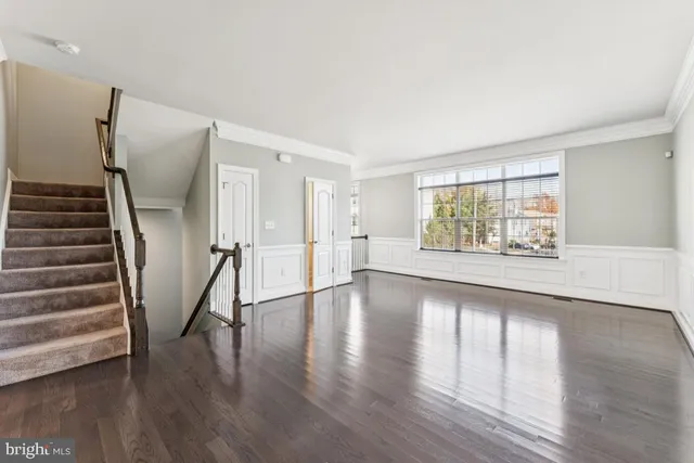 a kitchen with granite countertop a sink a counter top space and cabinets
