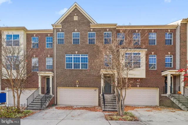 a front view of a building with garden