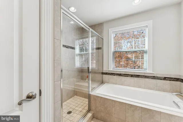 a bathroom with a bathtub and a sink