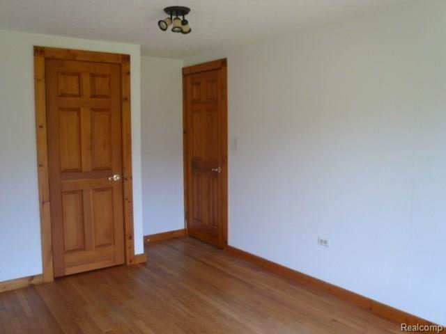 7888 Byron Road Howell, MI 48855 - Photo 18 of 26 18 MAIN FLOOR BEDROOM 6 PANEL DOORS.jpg