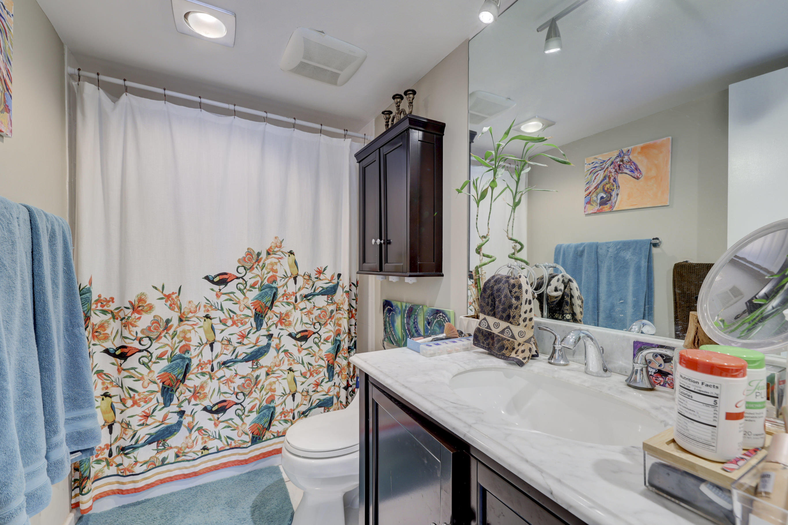 531 North Ocean Boulevard, Unit 710 Pompano Beach, FL 33062 - Photo 20 of 39 a bathroom with a granite countertop sink and a mirror
