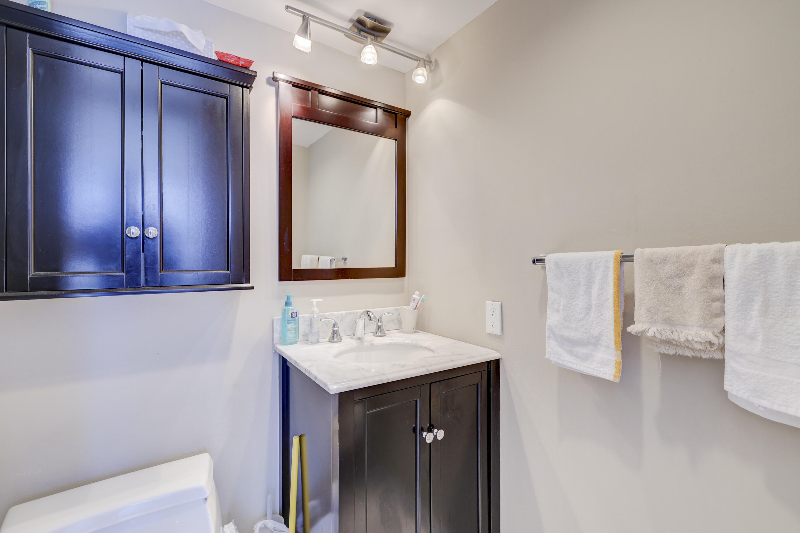 531 North Ocean Boulevard, Unit 710 Pompano Beach, FL 33062 - Photo 24 of 39 a bathroom with a sink and a mirror