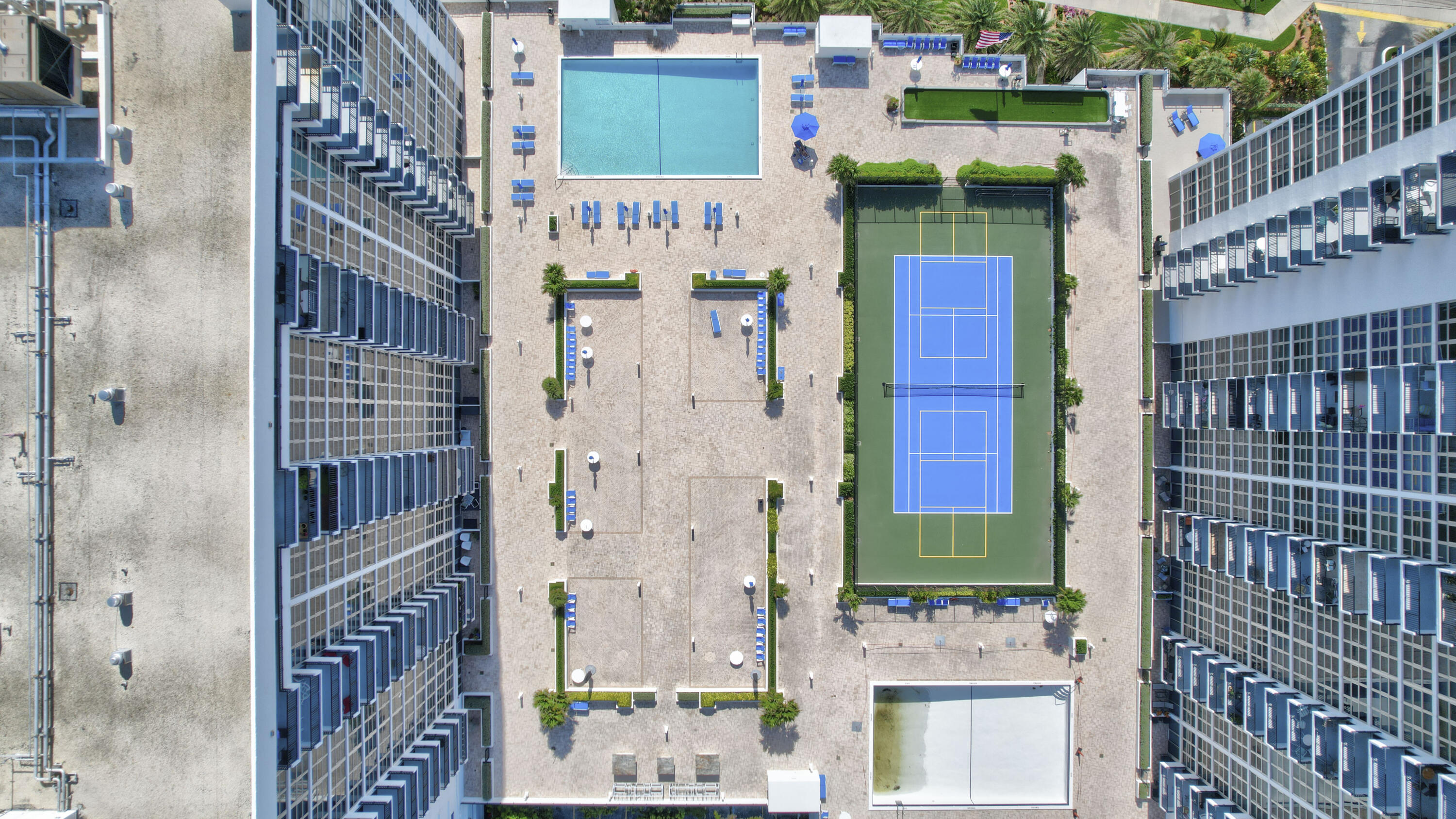 531 North Ocean Boulevard, Unit 710 Pompano Beach, FL 33062 - Photo 29 of 39 a front view of a multi story building with yard