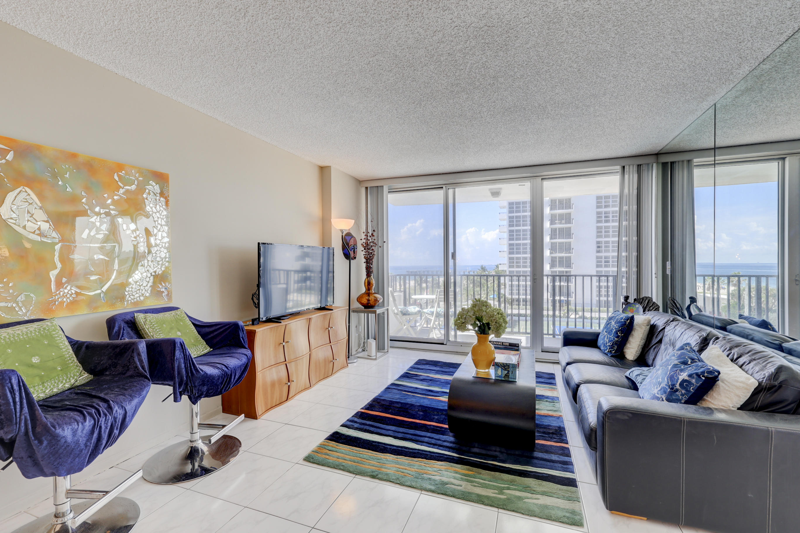 531 North Ocean Boulevard, Unit 710 Pompano Beach, FL 33062 - Photo 5 of 39 a living room with furniture and a large window