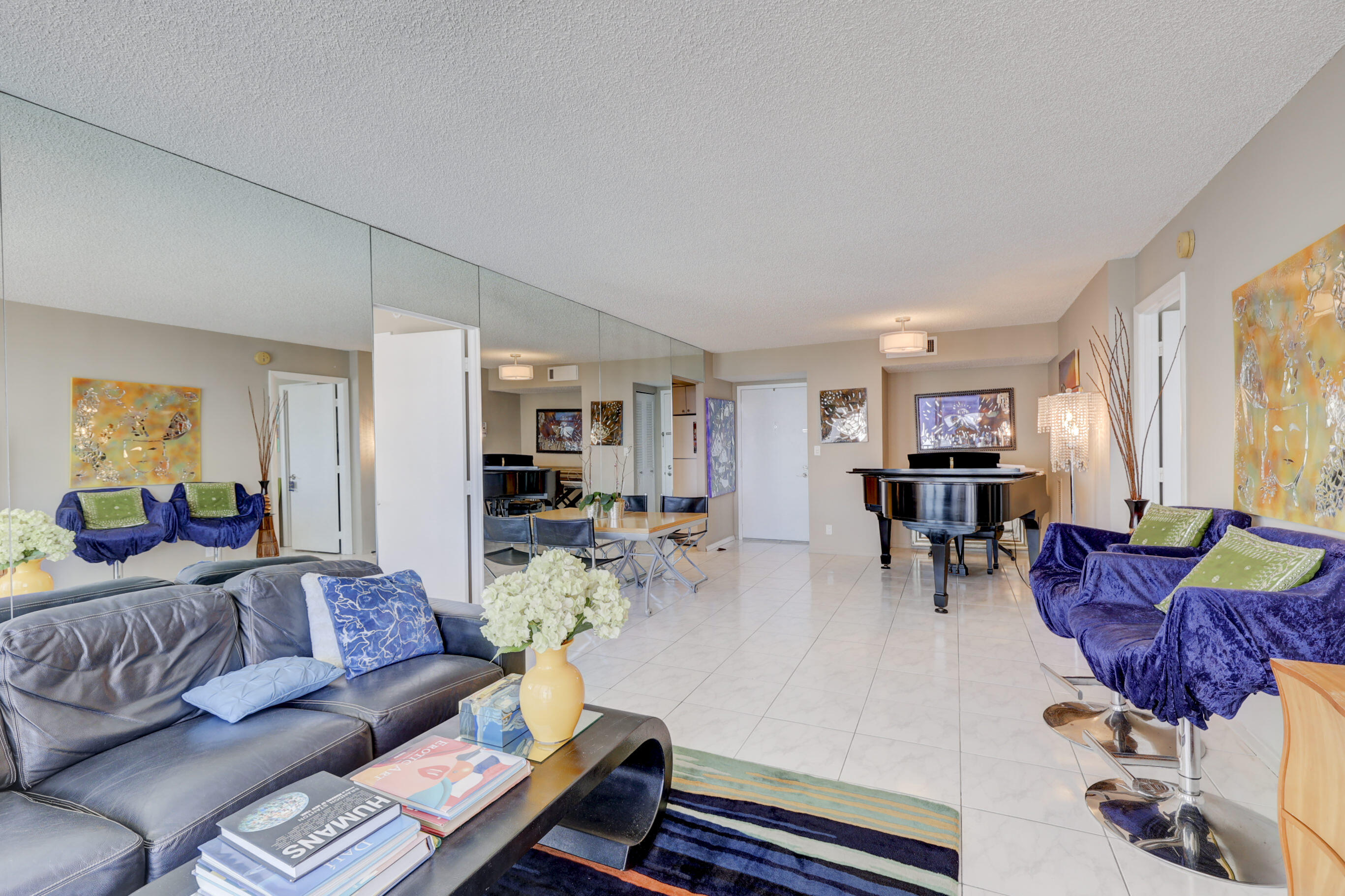 531 North Ocean Boulevard, Unit 710 Pompano Beach, FL 33062 - Photo 8 of 39 a living room with furniture and wooden floor