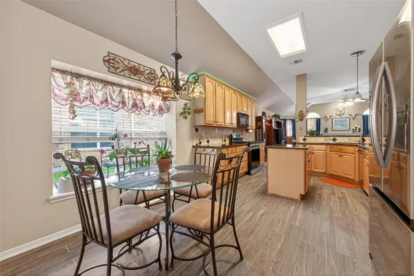 a view of a dining room with furniture window and wooden floor
