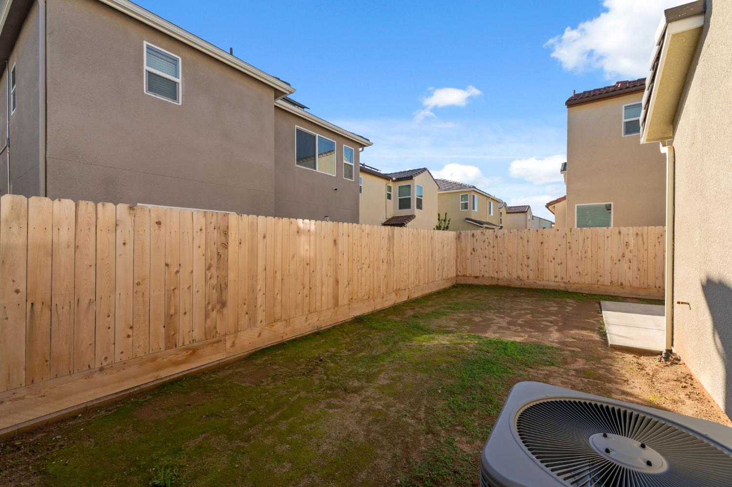 1116 Elevations Way West Madera, CA 93636 - Photo 24 of 35 a view of a backyard with a fence