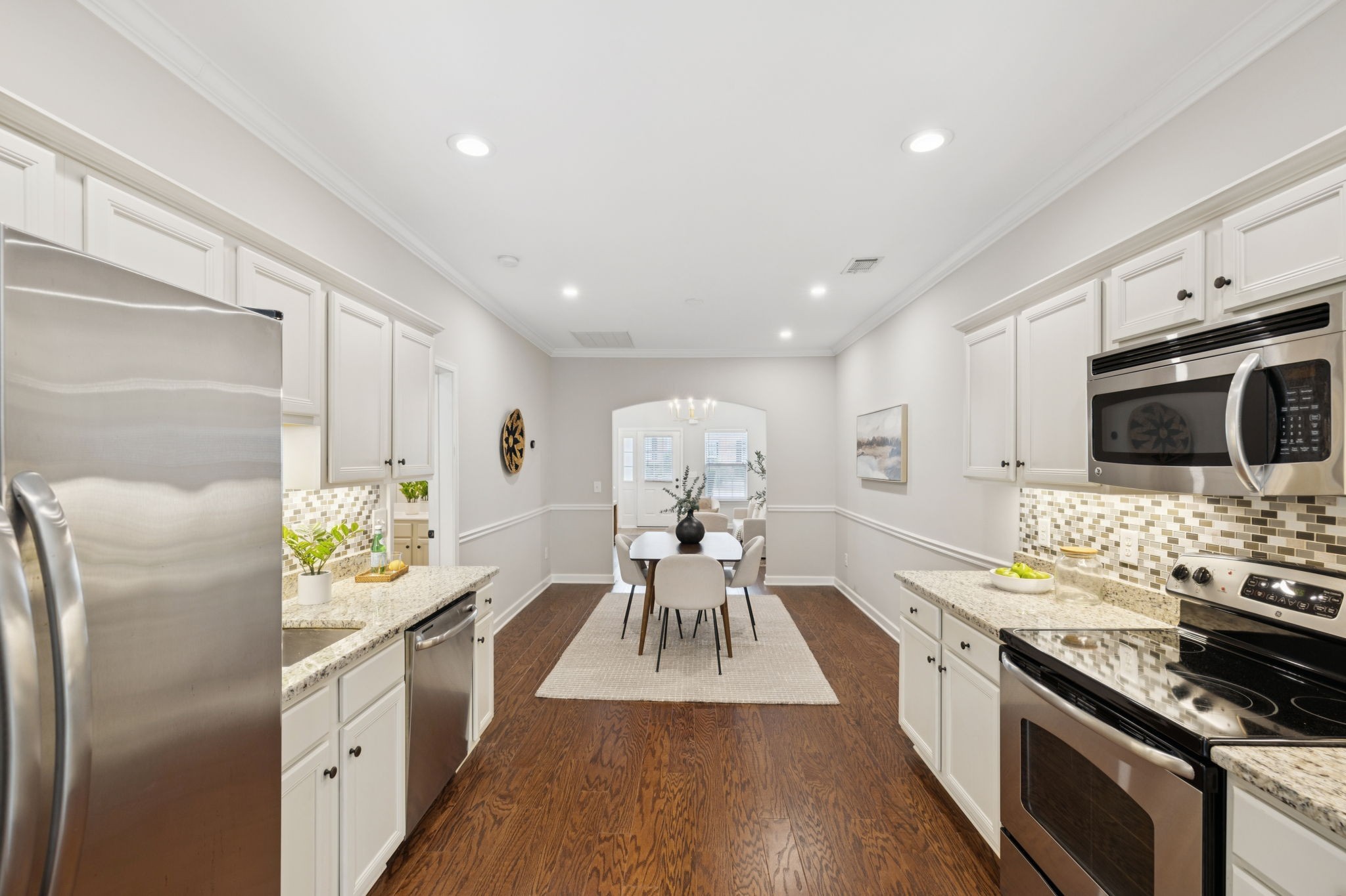1101 Downs Boulevard, Unit 295 Franklin, TN 37064 - Photo 12 of 33 a kitchen with stainless steel appliances a stove a sink and a refrigerator