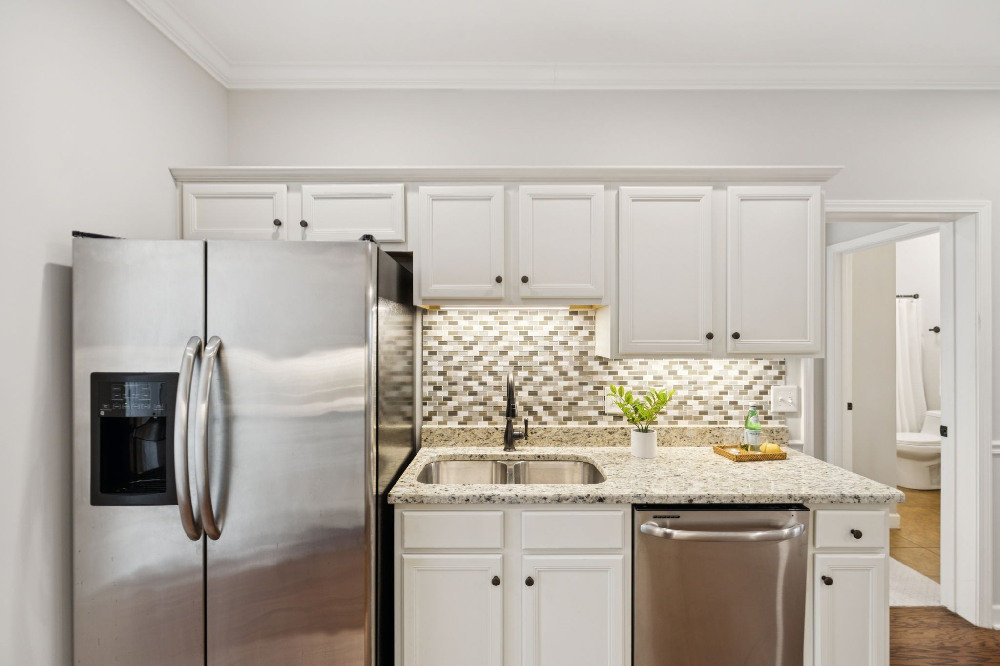 1101 Downs Boulevard, Unit 295 Franklin, TN 37064 - Photo 14 of 33 a kitchen with stainless steel appliances granite countertop a refrigerator and a sink