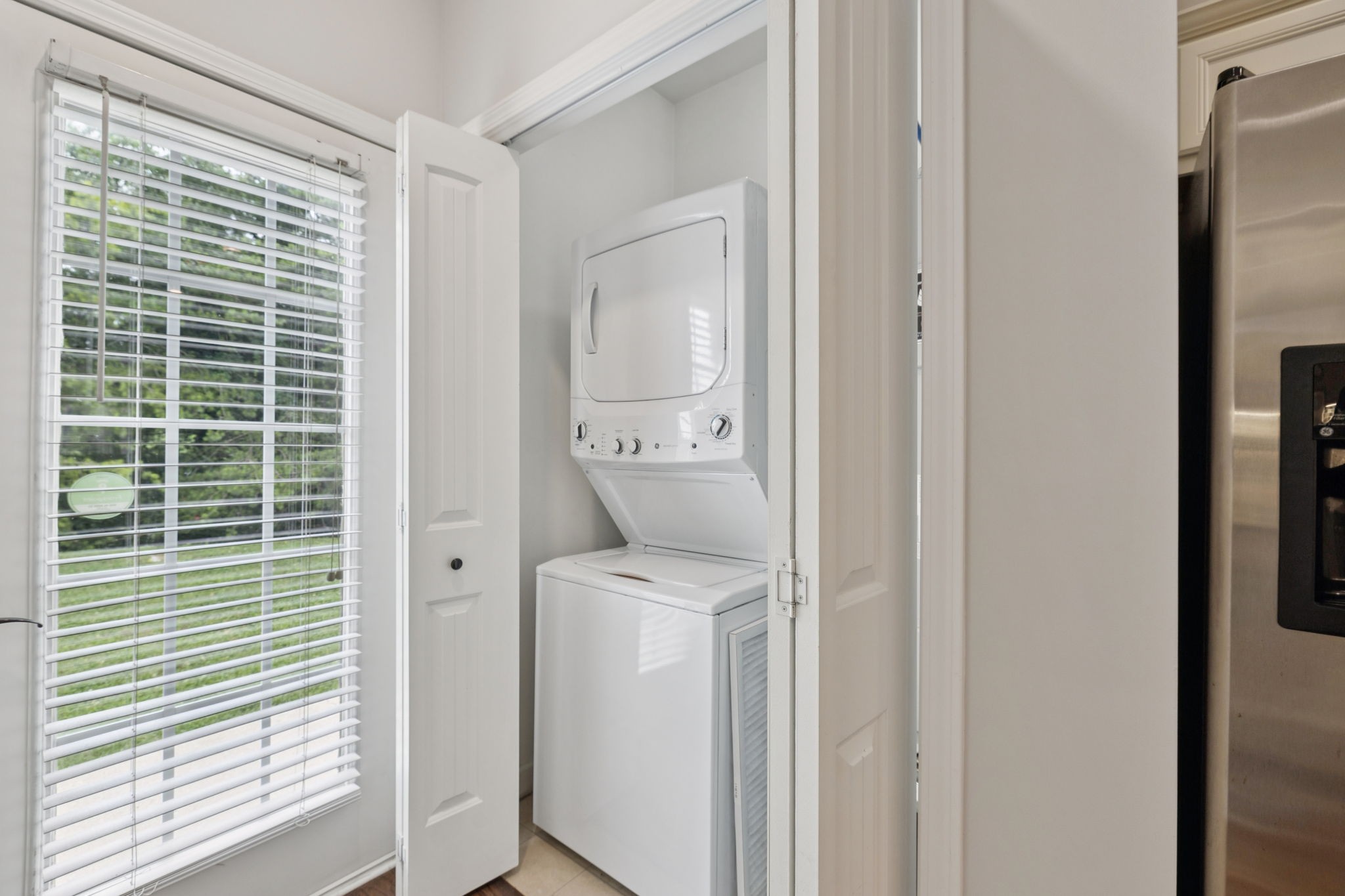 1101 Downs Boulevard, Unit 295 Franklin, TN 37064 - Photo 17 of 33 a utility room with a window dryer and washer