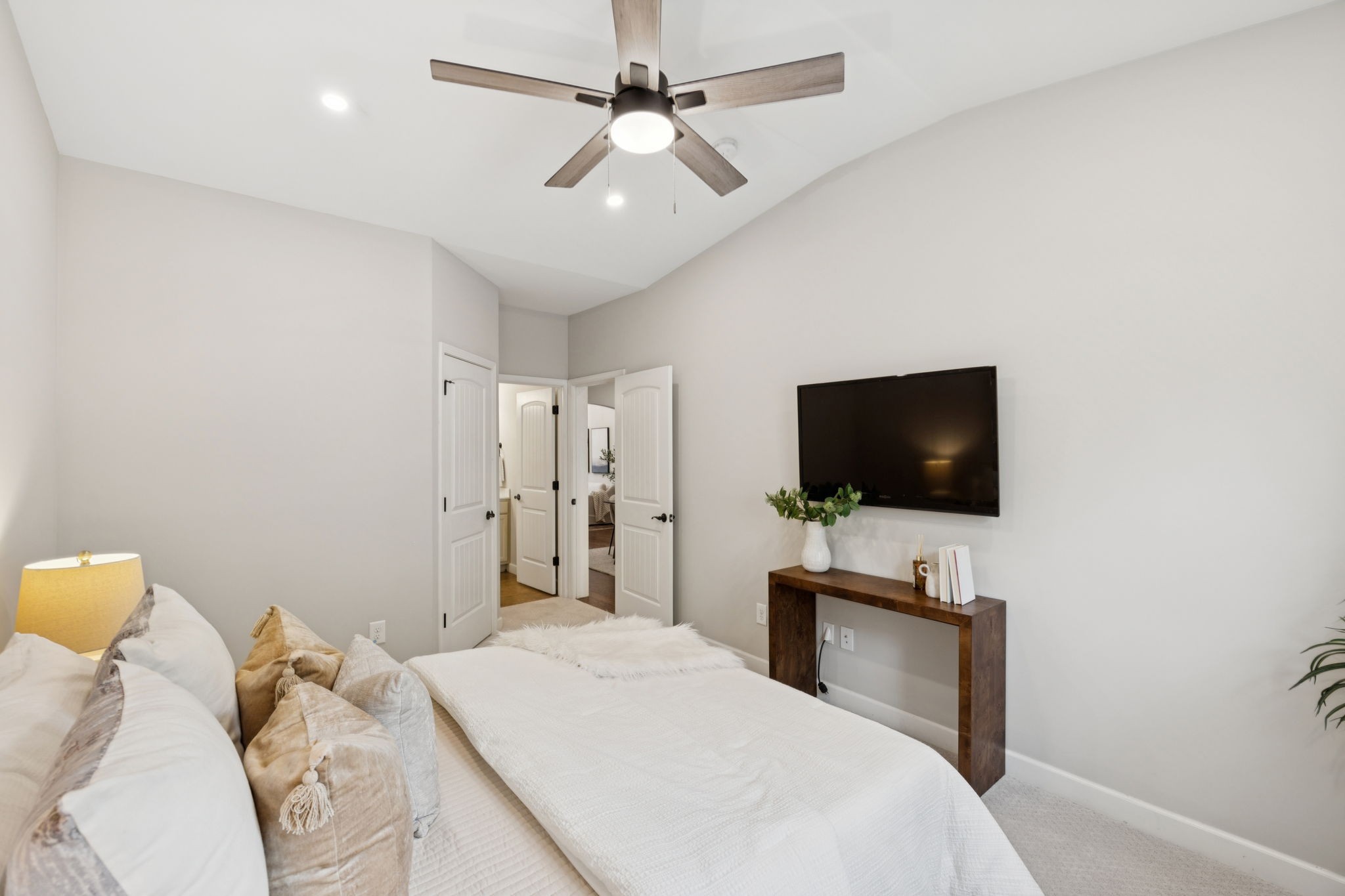 1101 Downs Boulevard, Unit 295 Franklin, TN 37064 - Photo 19 of 33 a bedroom with a bed and a flat screen tv