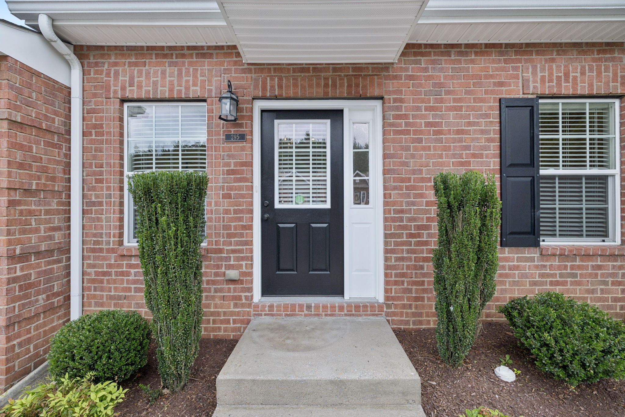 1101 Downs Boulevard, Unit 295 Franklin, TN 37064 - Photo 2 of 33 a front view of a house with brick walls