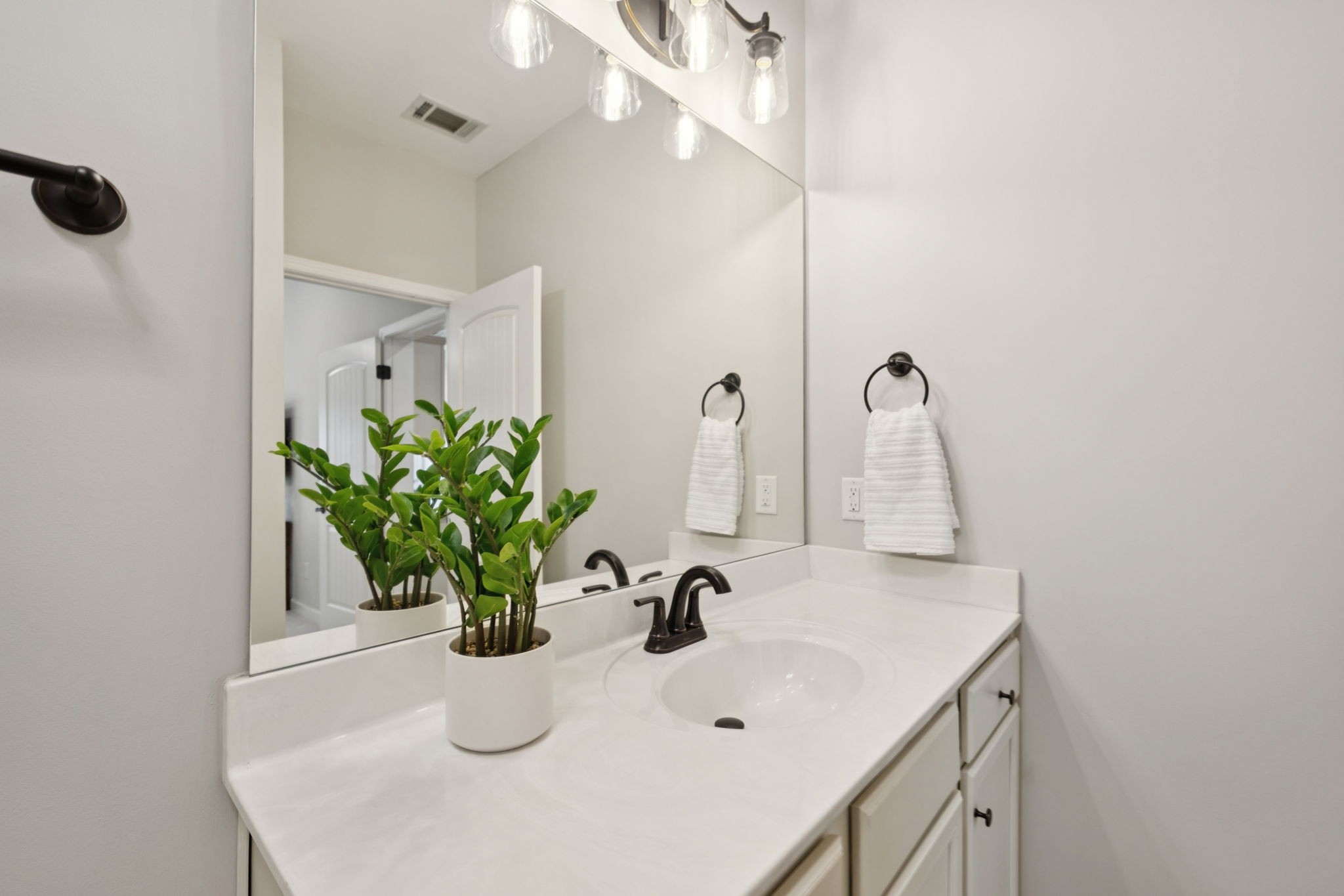 1101 Downs Boulevard, Unit 295 Franklin, TN 37064 - Photo 21 of 33 a bathroom with a sink a vanity and a mirror