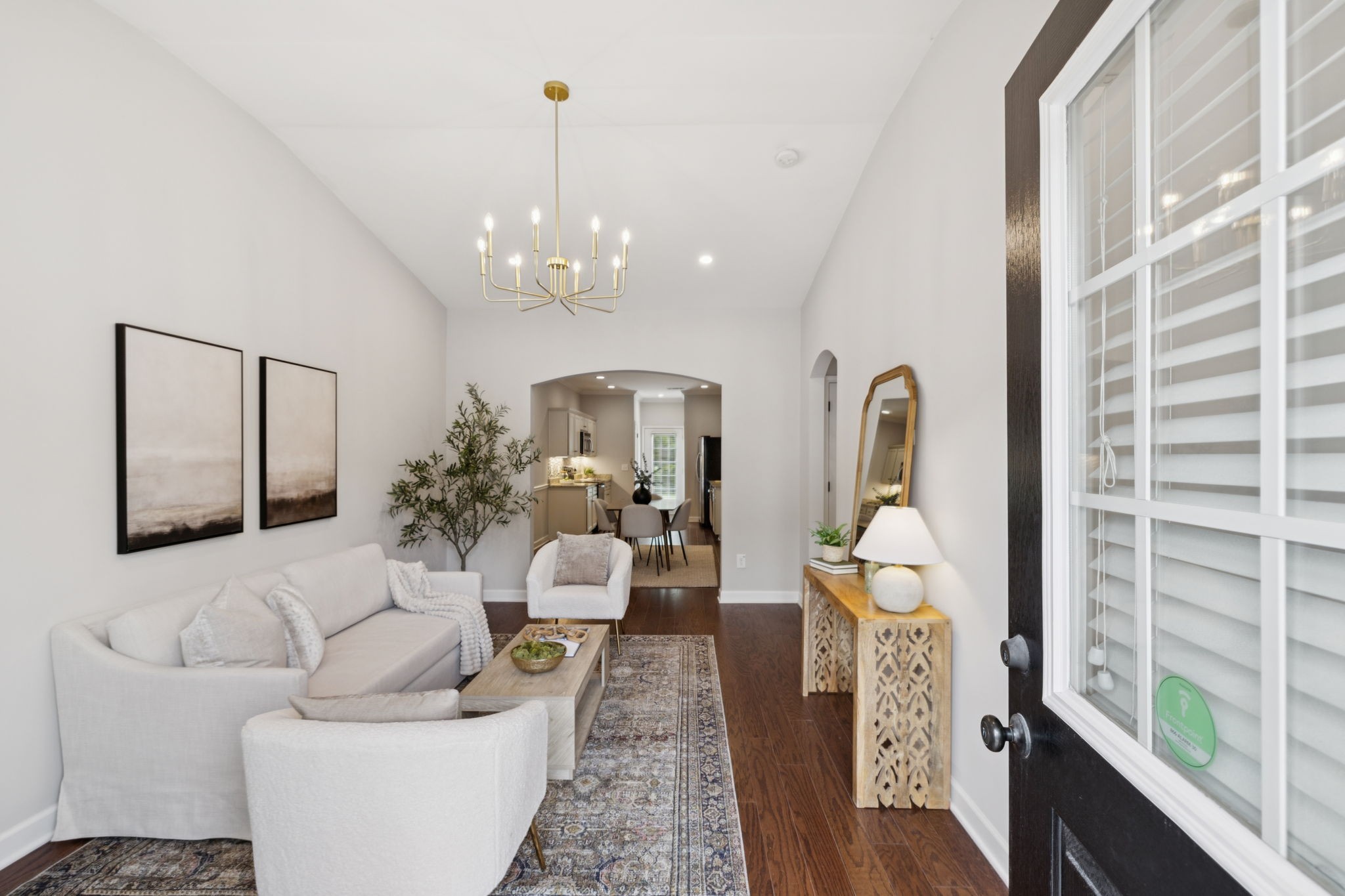 1101 Downs Boulevard, Unit 295 Franklin, TN 37064 - Photo 4 of 33 a living room with furniture and a chandelier