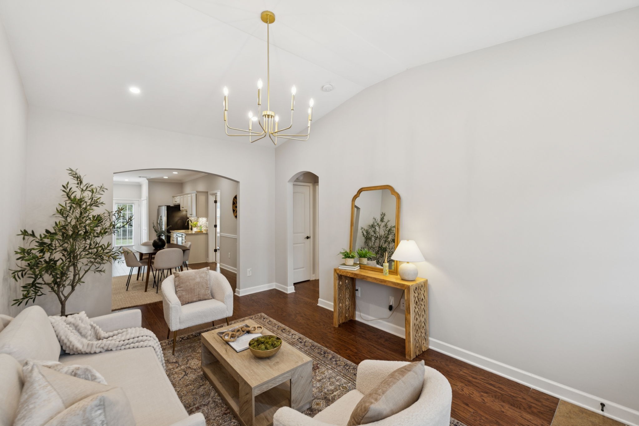 1101 Downs Boulevard, Unit 295 Franklin, TN 37064 - Photo 5 of 33 a living room with furniture and a chandelier