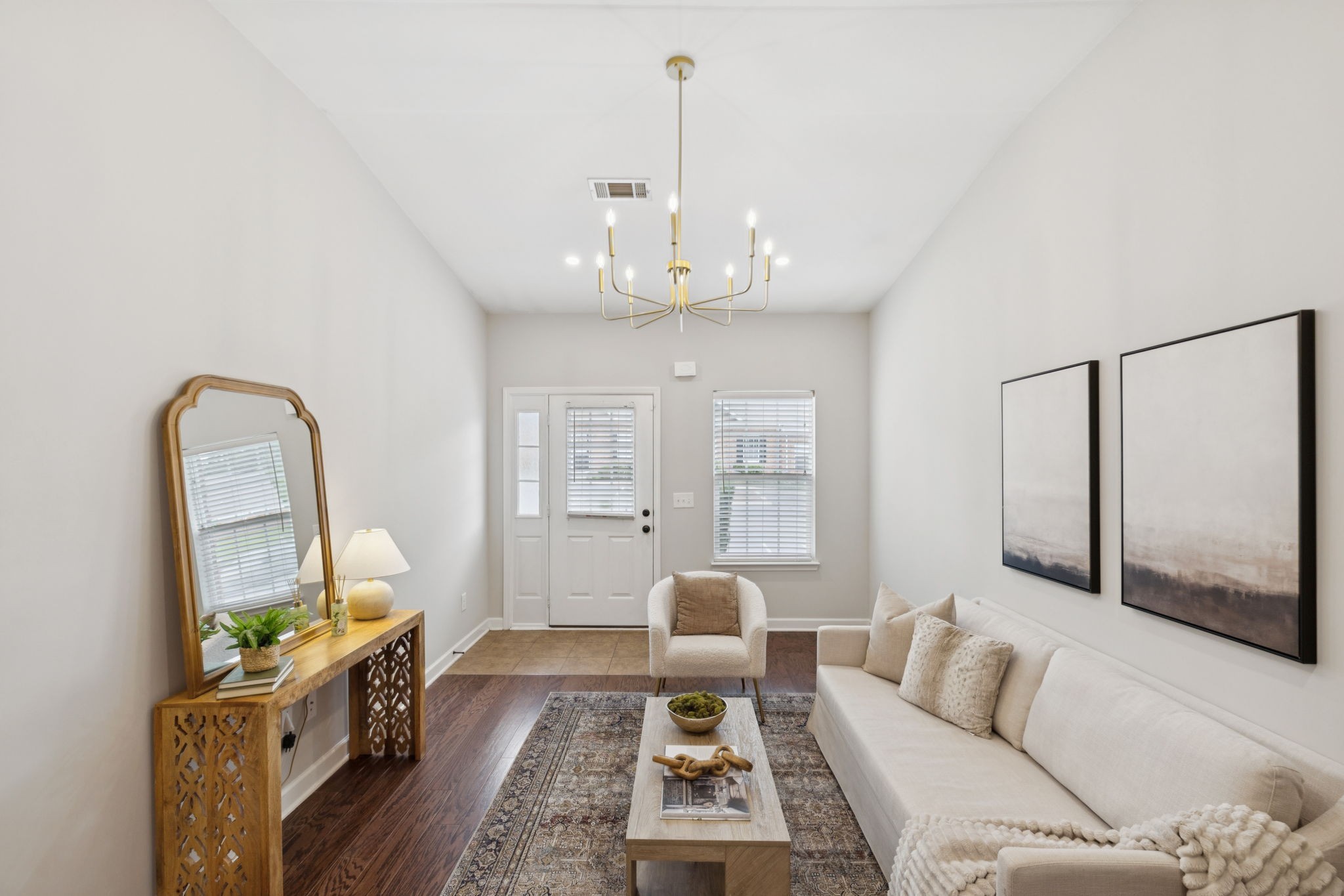 1101 Downs Boulevard, Unit 295 Franklin, TN 37064 - Photo 7 of 33 a living room with furniture and a chandelier
