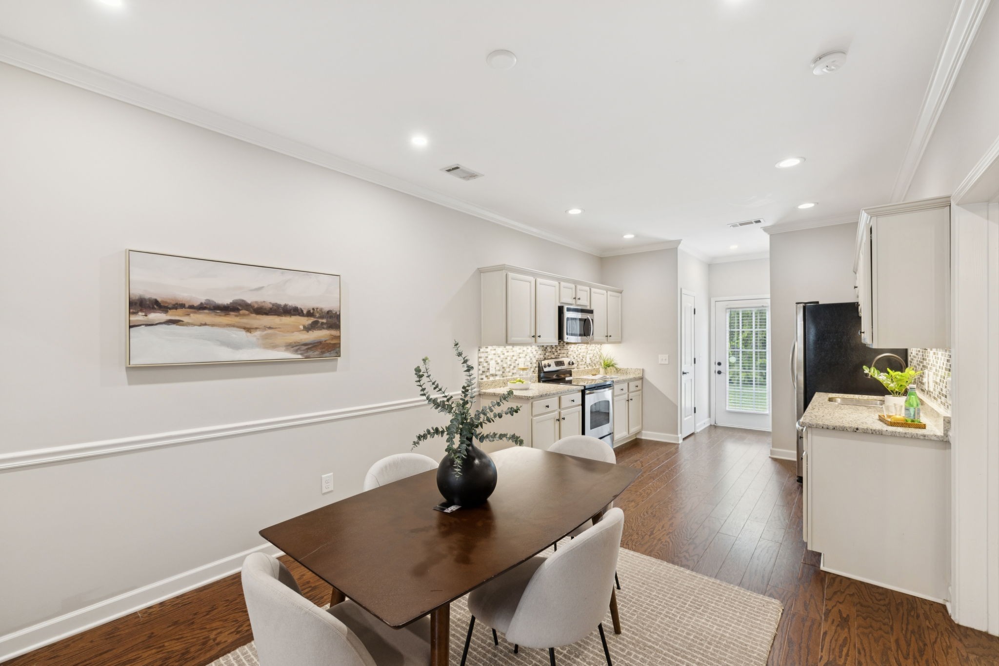 1101 Downs Boulevard, Unit 295 Franklin, TN 37064 - Photo 8 of 33 a living room with stainless steel appliances kitchen island granite countertop furniture and a dining table