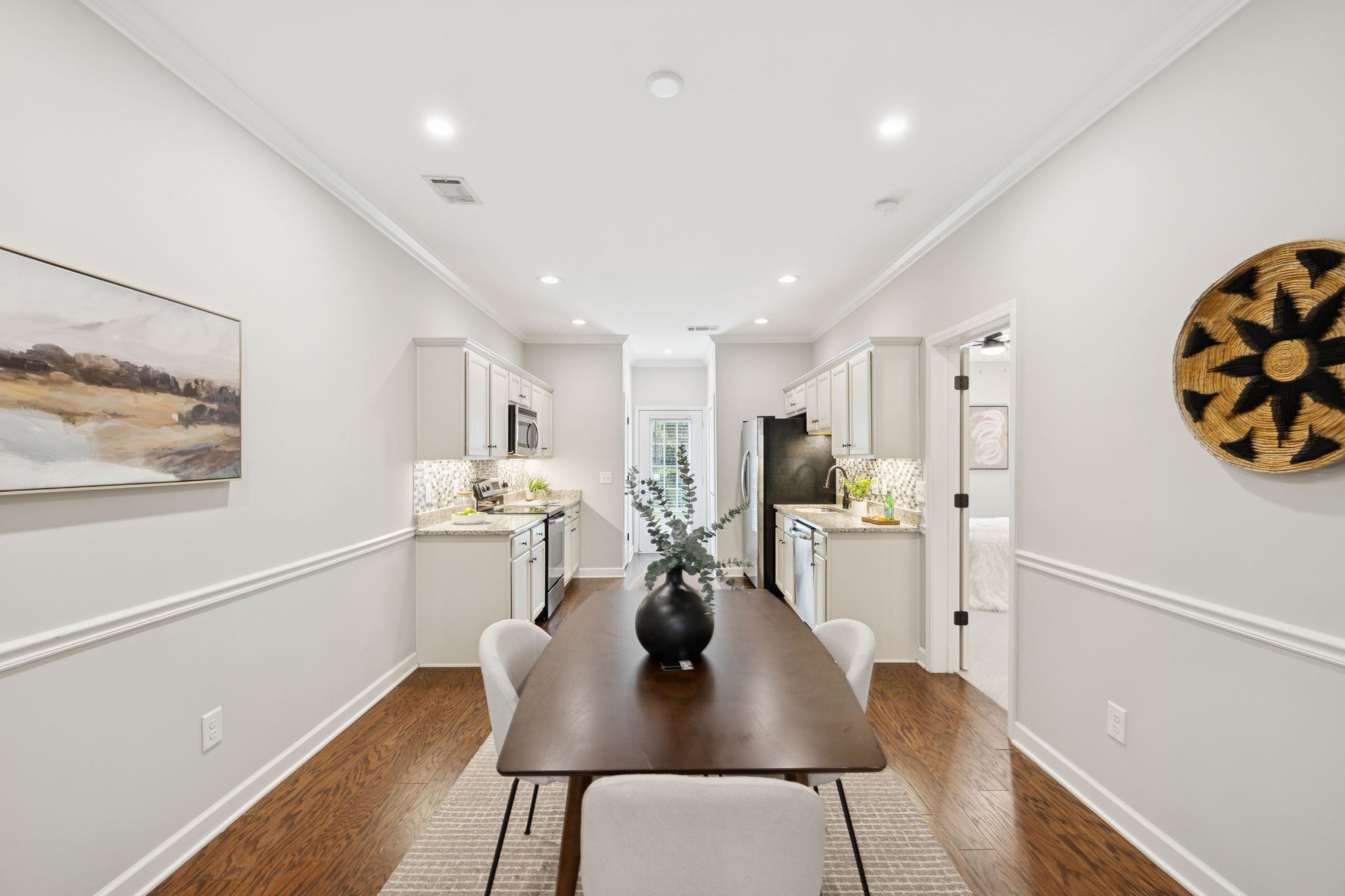1101 Downs Boulevard, Unit 295 Franklin, TN 37064 - Photo 9 of 33 a view of a dining room with furniture a kitchen and chandelier