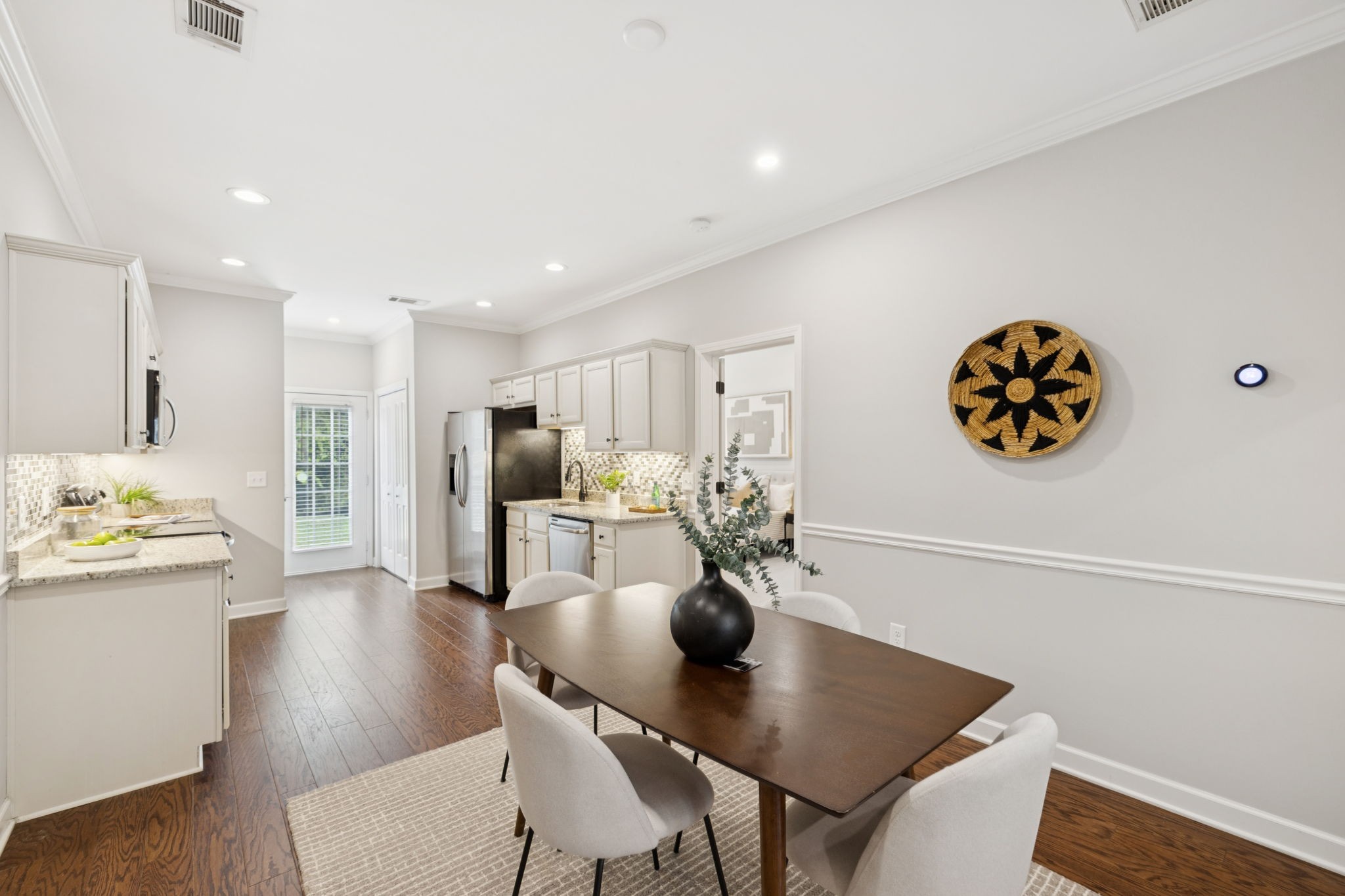 1101 Downs Boulevard, Unit 295 Franklin, TN 37064 - Photo 10 of 33 a view of a dining room with furniture and wooden floor