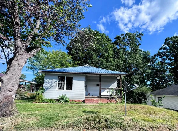 a front view of a house with yard